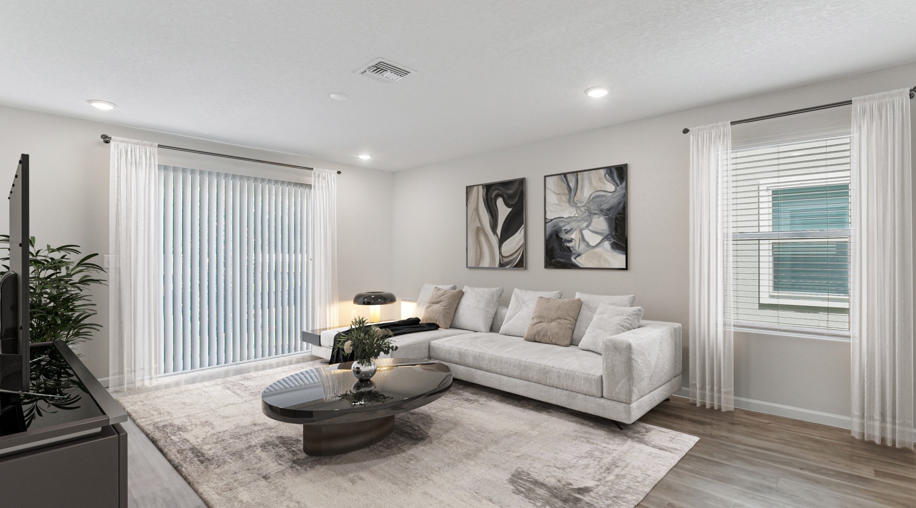 Furnished townhome living room with ample natural lighting at The Harper Trout River