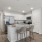Stainless steel appliances inside townhome kitchens at The Harper Trout River